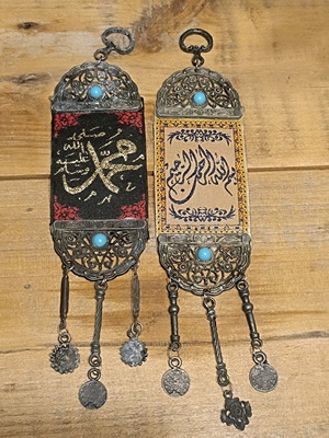 Set of 2 used oriental amulets with Arabic calligraphy