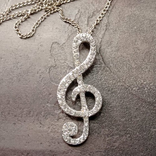 Pendant necklace with treble clef and rhinestones like new