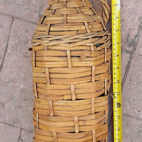 Vintage wicker wrapped demijohn with corncob stopper, used