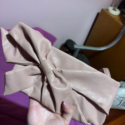 Clutch bag hand-held like new, pink with bow design