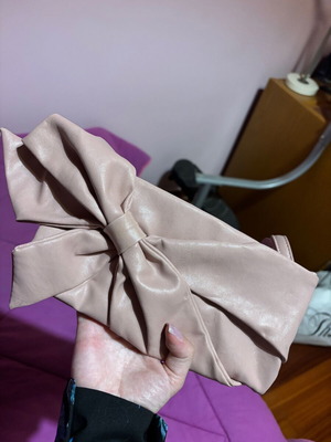 Clutch bag hand-held like new, pink with bow design