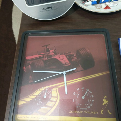 Johnny Walker wall clock used with small crack