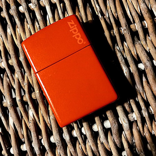 Zippo lighter used, large bright red