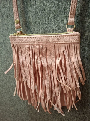 H&M pink crossbody bag for girls used with fringes and gold details