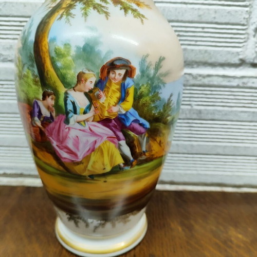 Old porcelain vase used, hand-painted with romantic scene