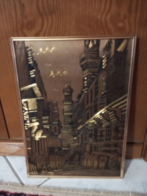 Metal embossed frame with Eastern street theme like new