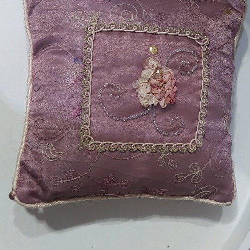 Vintage decorative pillow used with embroidery and embossed flowers