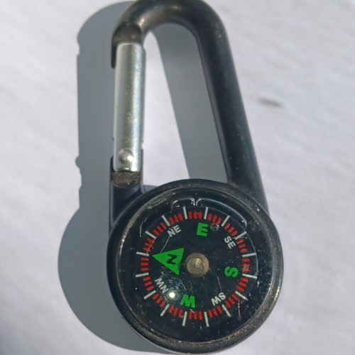Plastic carabiner with built-in compass used