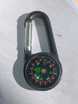 Plastic carabiner with built-in compass used