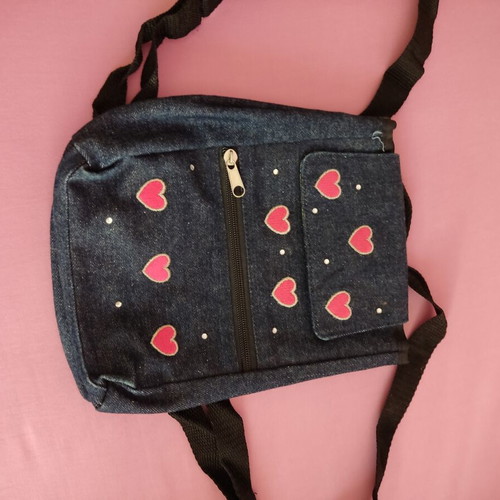 Small denim backpack with heart designs like new