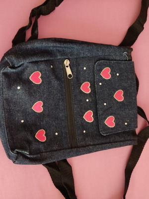 Small denim backpack with heart designs like new