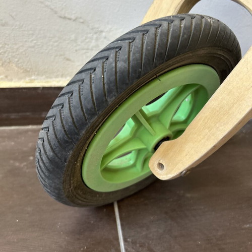 Wooden children's balance bike with extra rear wheel