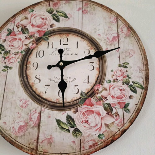 Decorative wall clock used, analog with floral design