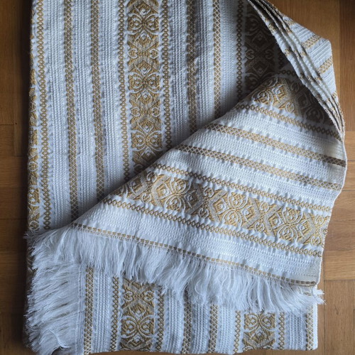 Vintage woven quilt used, shades of beige and gold