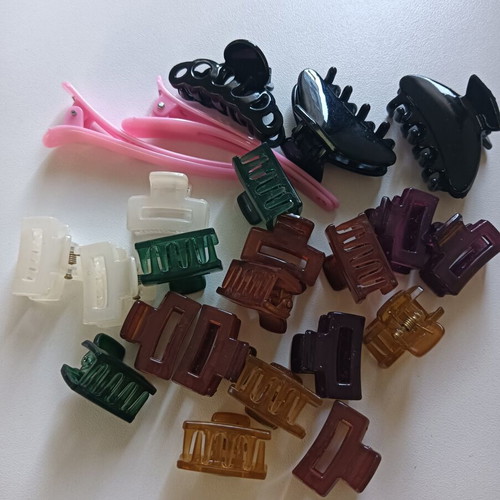 Mini hair clips in various colors and sizes, unused