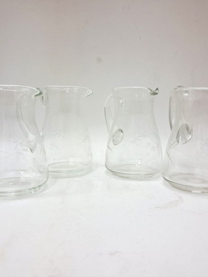 Vintage glass pitchers with engraved floral motifs, set of 4, like new