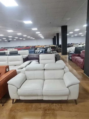 Leather two-seater sofa light gray cream with electric relax mechanism new