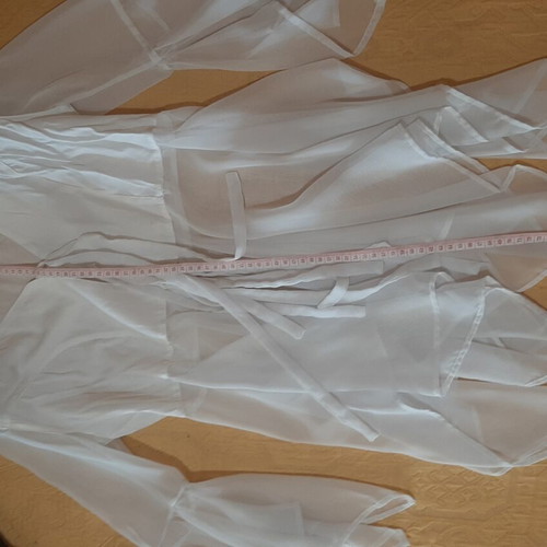White women's shirt like new, asymmetrical with bows and cords
