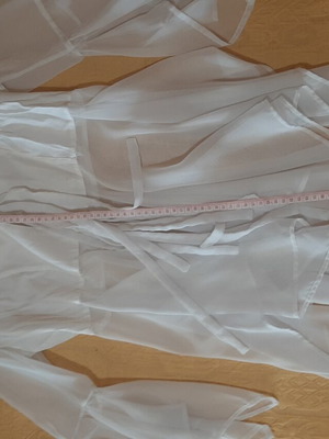 White women's shirt like new, asymmetrical with bows and cords
