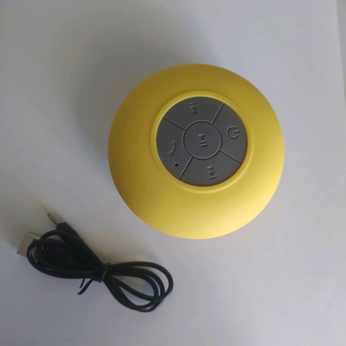 Bluetooth waterproof speaker yellow with detachable suction cup and charging cable