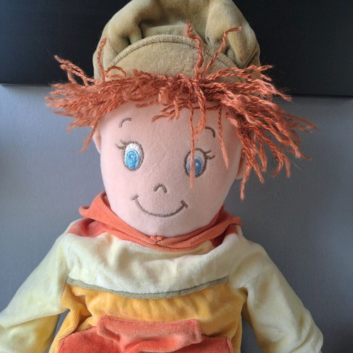Cloth doll with hat and orange details like new