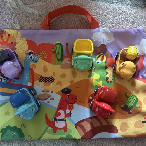Vehicle set with dinosaurs and play mat like new