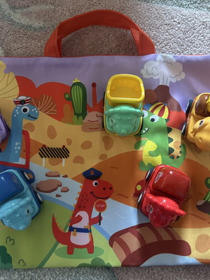 Vehicle set with dinosaurs and play mat like new