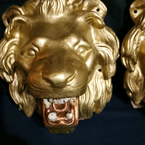 Decorative items used, cast iron lion heads, old antiques