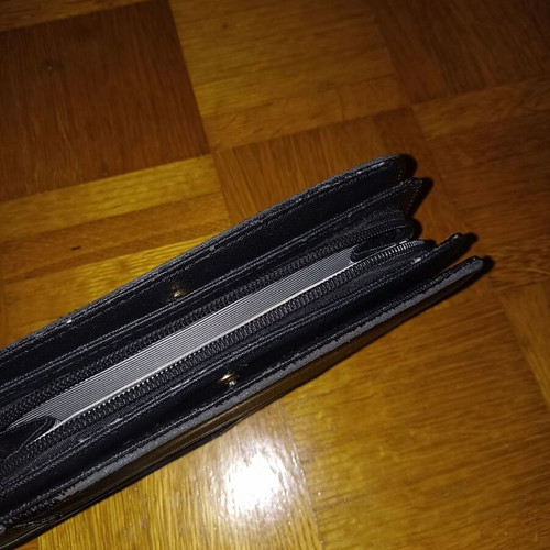 Black wallet slightly used with multiple compartments