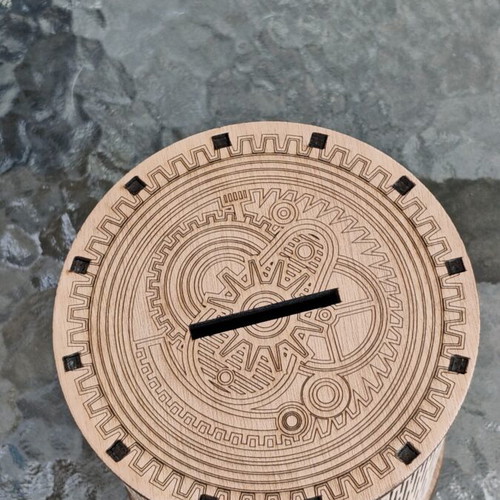 Handmade wooden laser-cut piggy bank with mechanical design