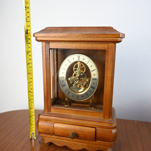Wooden table clock used with visible skeleton mechanism and drawer