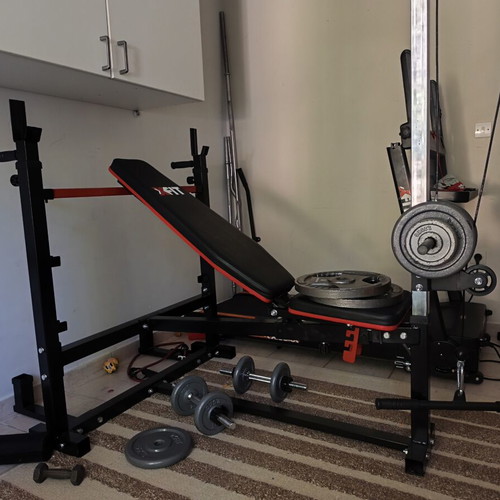 Workout bench with leg pulley system and biceps pad like new