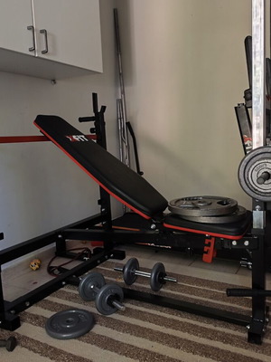 Workout bench with leg pulley system and biceps pad like new
