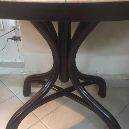 Vintage table with bent wood and oval salmon-pink marble used