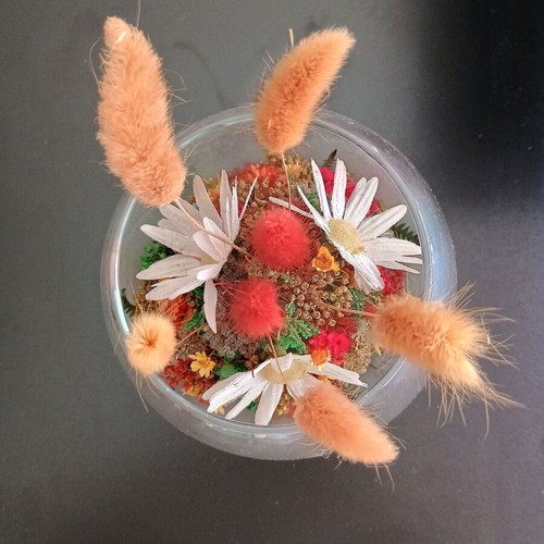 Decorative glass with dried flowers used