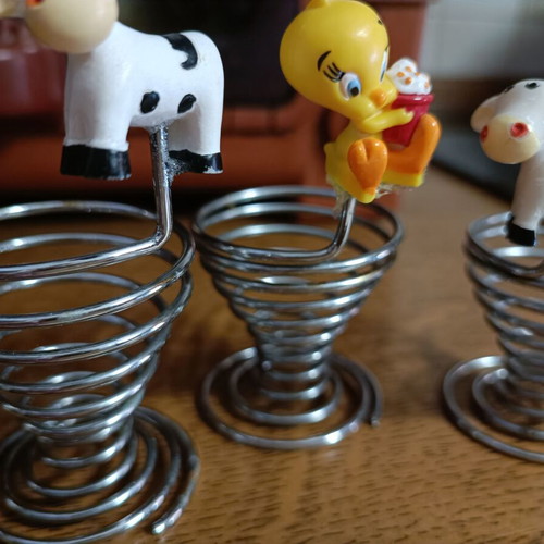 Set of 3 used egg holders with children characters, stainless steel