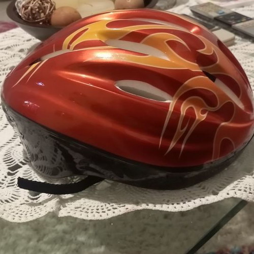 Children's helmet for bike and scooter used, medium size, red with orange flames