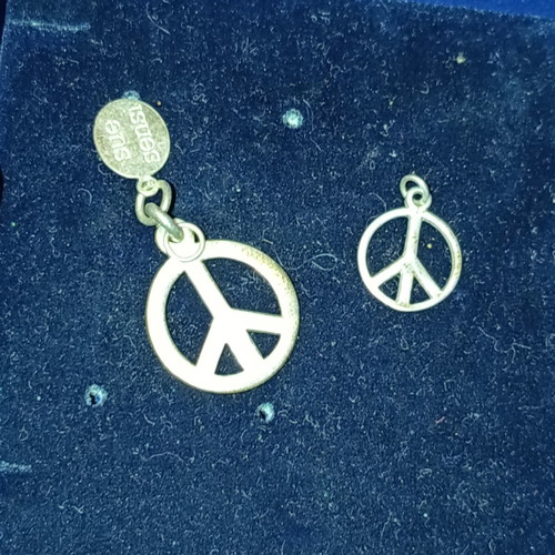 Peace symbol silver pendants set like new, two pieces