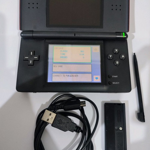 Nintendo DS Lite console used with Pokemon LeafGreen cartridge and accessories