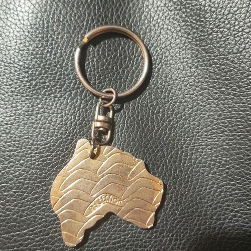 Australia Oceania Keychain like new with gold print