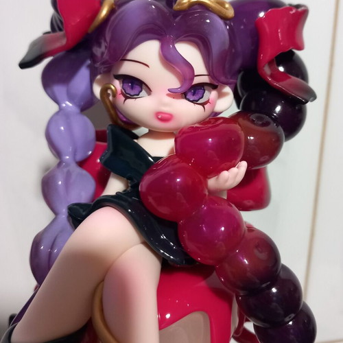 Anime cherry figure toy girl with long purple hair on cake cherry