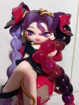 Anime cherry figure toy girl with long purple hair on cake cherry