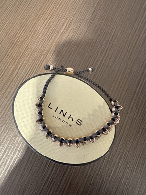 Links Of London collectible bracelet like new, rose gold and black cord