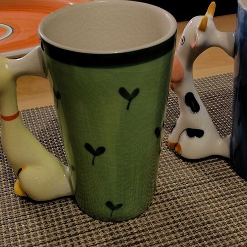 Large mugs used with cat and cow handles