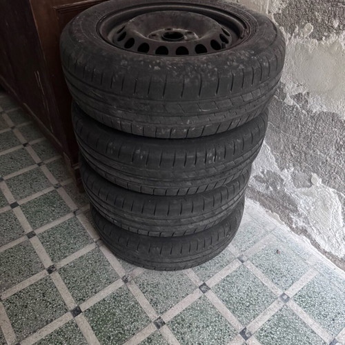 Used 195/65/R15 tires with steel rims, set of 4