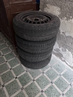Used 195/65/R15 tires with steel rims, set of 4