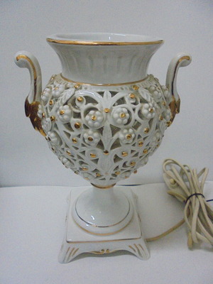 Porcelain table lamp used with openwork decoration and gilding