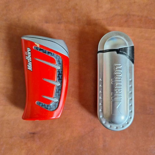 Set of 2 vintage collectible lighters, grey metal and red racing