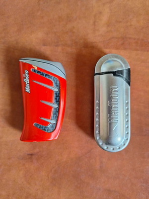 Set of 2 vintage collectible lighters, grey metal and red racing