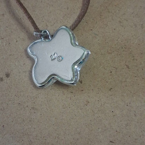 Swarovski vintage flower pendant with brown cord like new